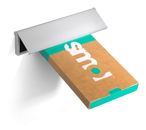 green and brown packaging through the letterbox