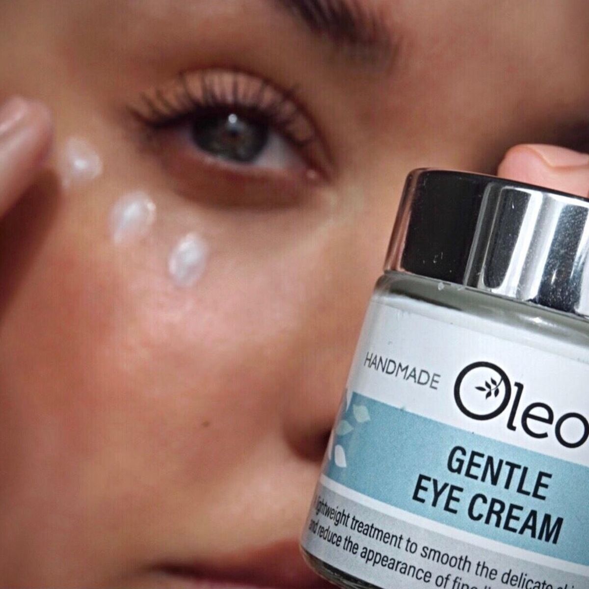 Lady applying Gentle Eye Cream below her eyes