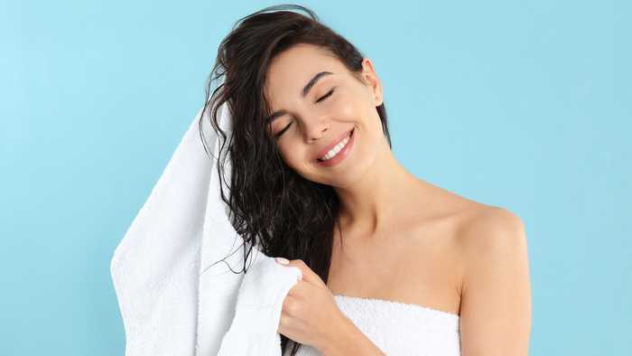Lady blot drying her hair