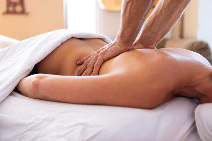 lady having a massage with sensual essential oils
