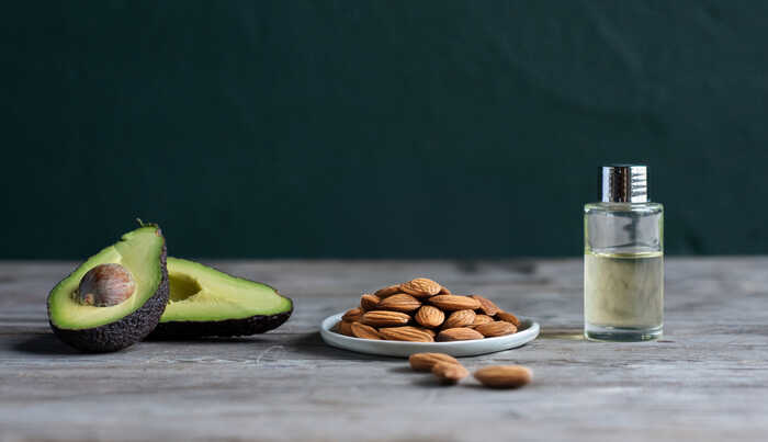raw essential oil ingredients including avocado, almonds and sunflower oil raw essential oil ingredients including avocado, almonds and sunflower oil