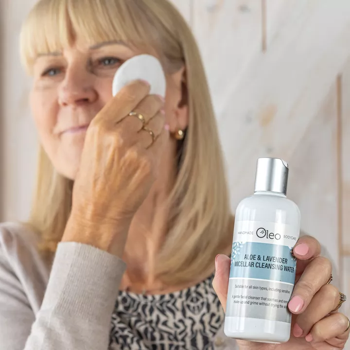 Lady using Oleo Bodycare Aloe &amp; Lavender Micellar Cleansing Water to remove make-up