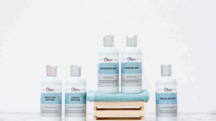 Vegan and cruelty-free bath soaks placed upon a worktop within a modern bathroom