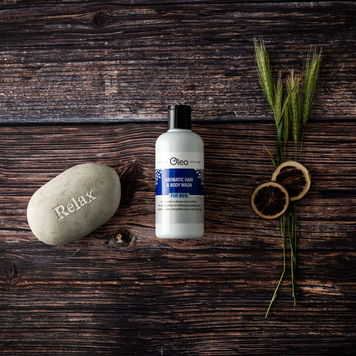Mens Aromatic Hair and Body Wash on a wooden bathroom countertop