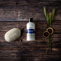 Mens Aromatic Hair and Body Wash on a wooden bathroom countertop